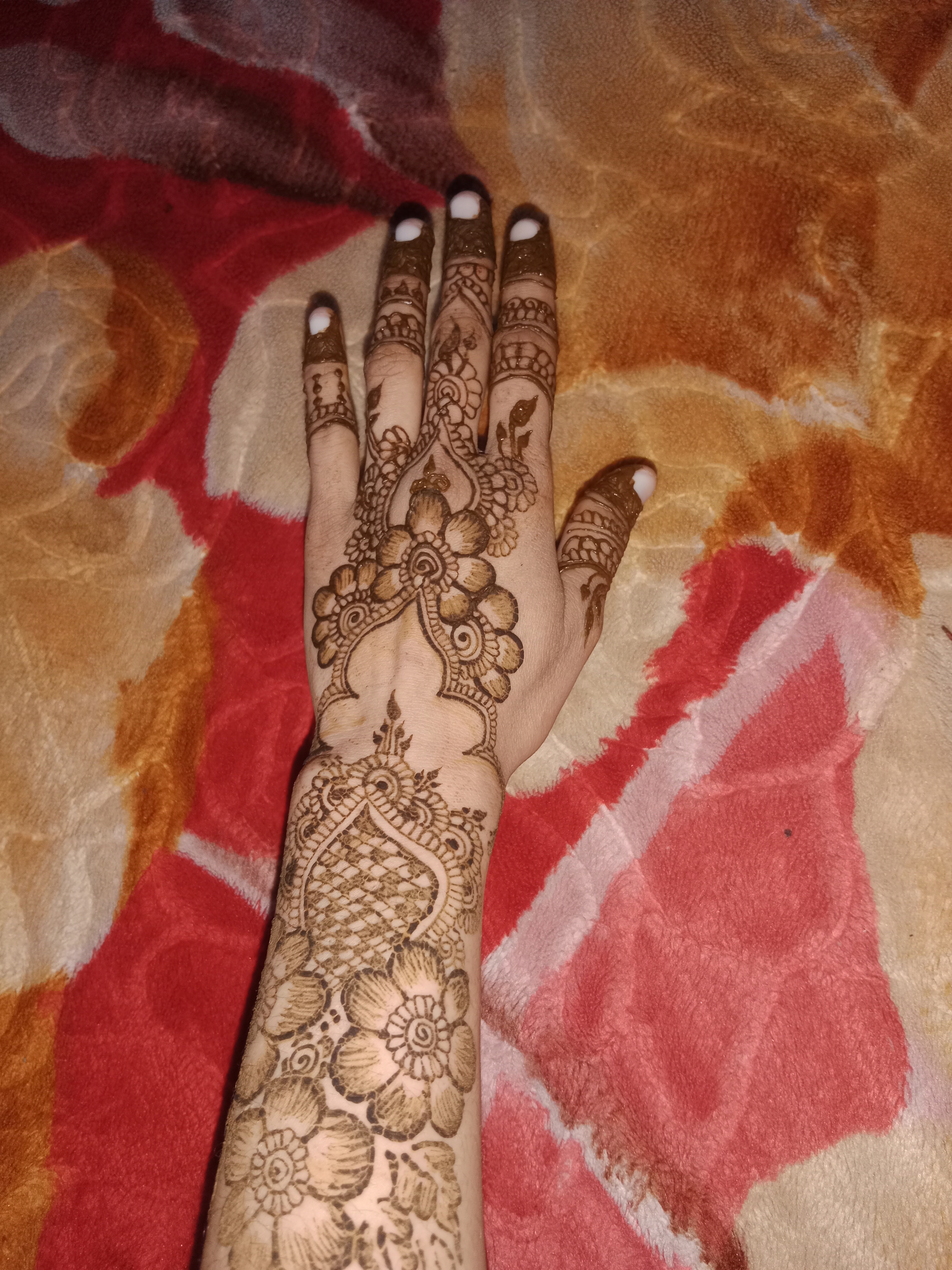 Intricate henna design on hand